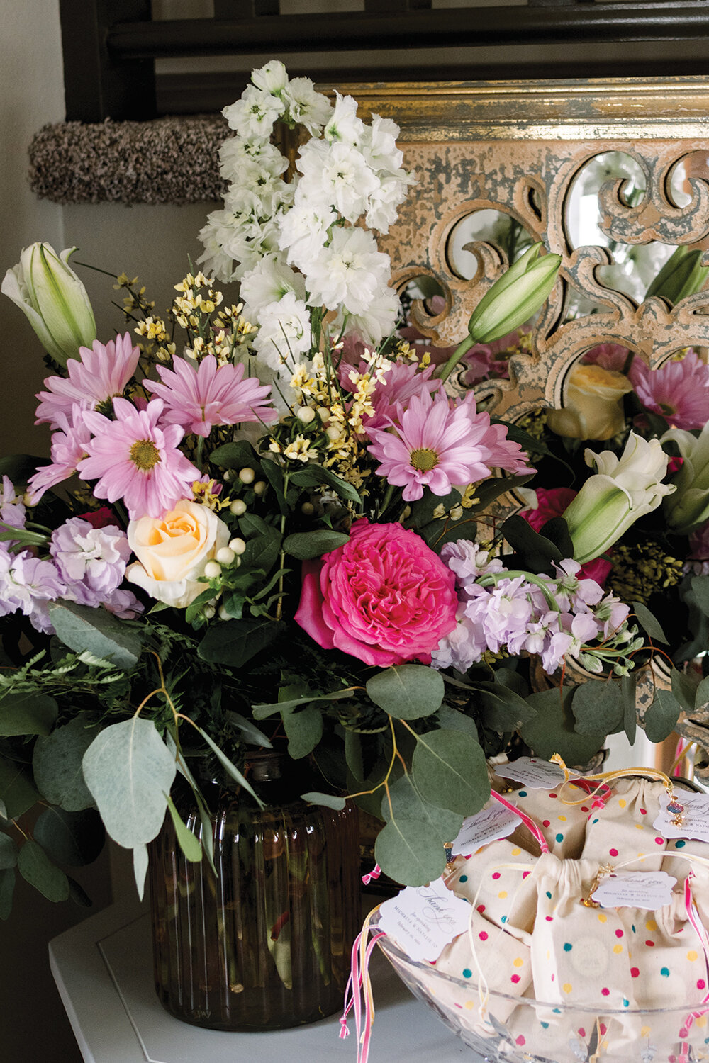 Eye-catching pink and yellow floral centerpiece for a girl’s baby shower, featuring a vibrant arrangement of blooms that enhances the festive atmosphere.