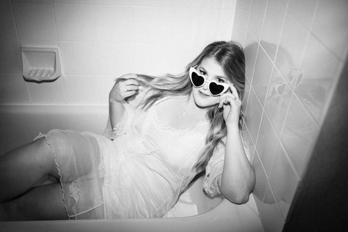 bride-in-bathtub-with-heart-sunglasses