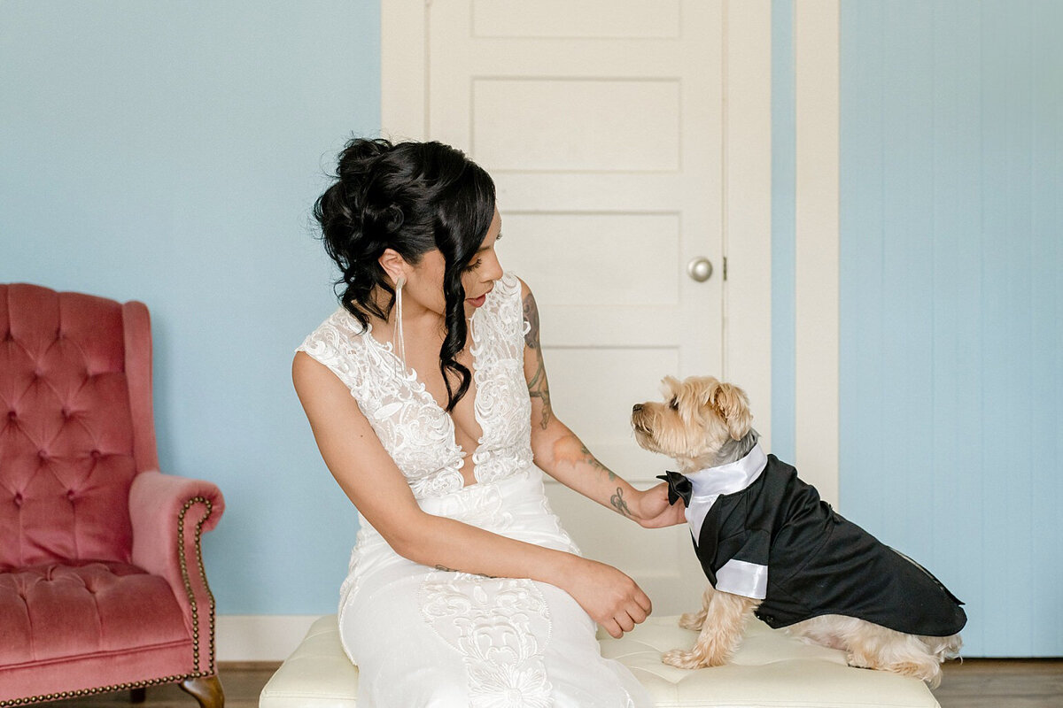 Bride with her dog getting ready
