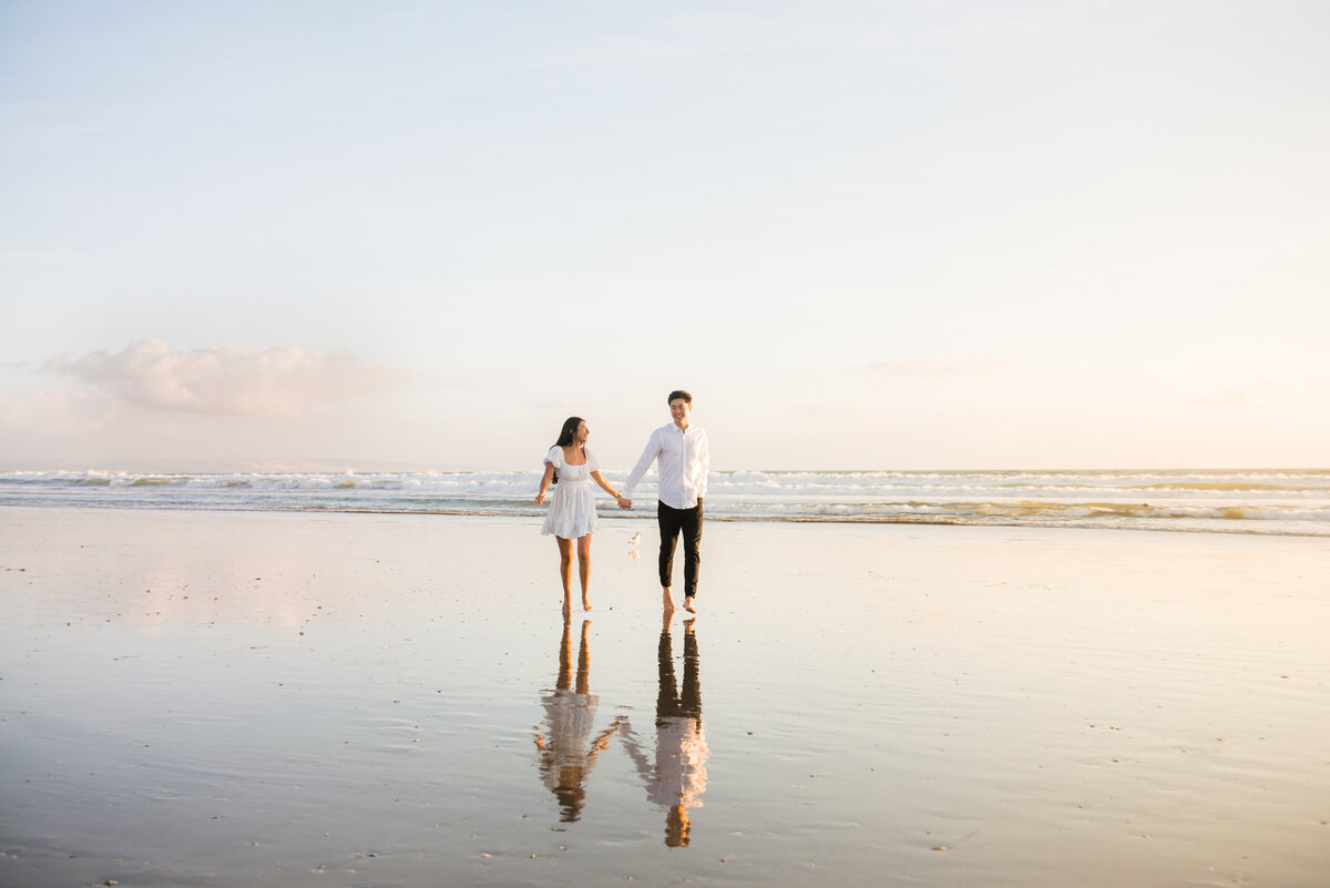 stunning photo of couple during sunset at the beach in san diego during engagement session by mattie taylor photography