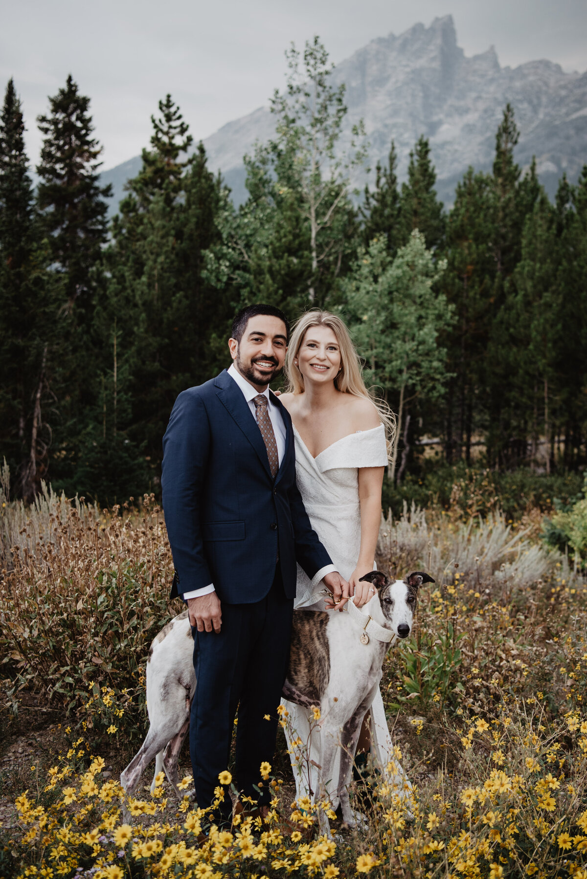 Photographers Jackson Hole capture bride and groom with dog