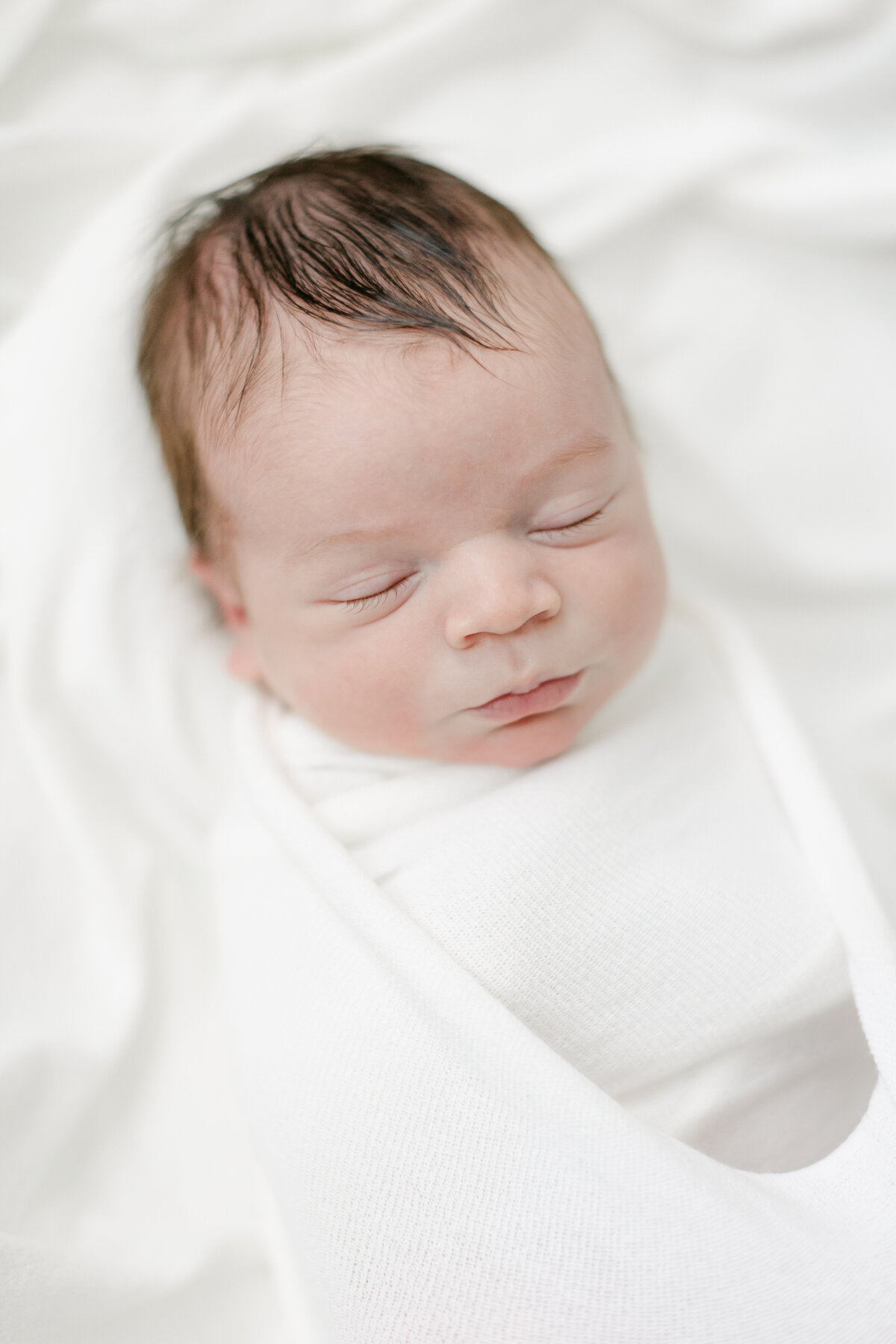 close up shot of baby's face highlighting his tiny features photographed by Philadelphia Newborn Photographer Tara Federico
