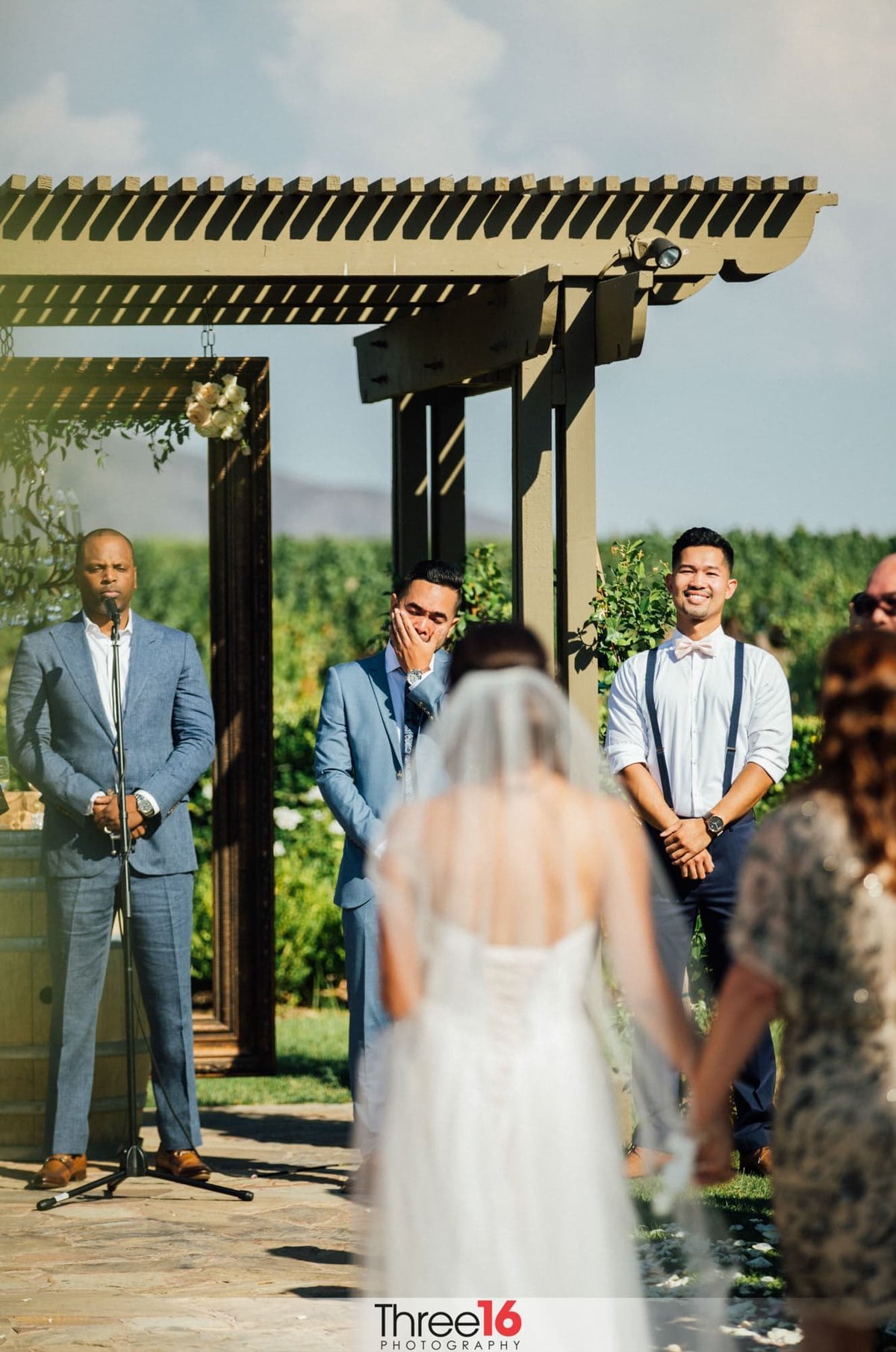 Groom fights back tears as his Bride is walking up the aisle