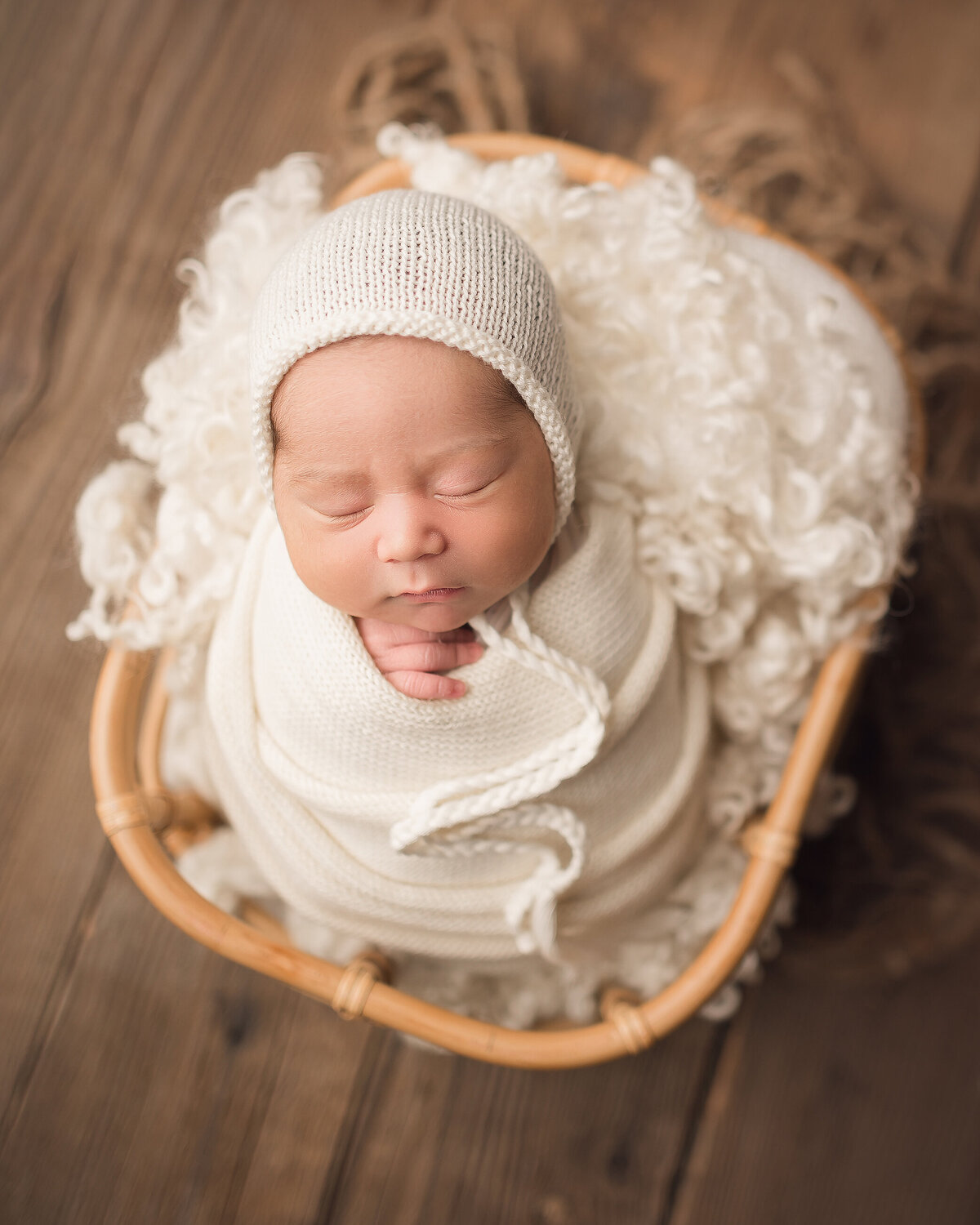 Baby boy newborn in boho basket southern Oregon photographer Katie Anne