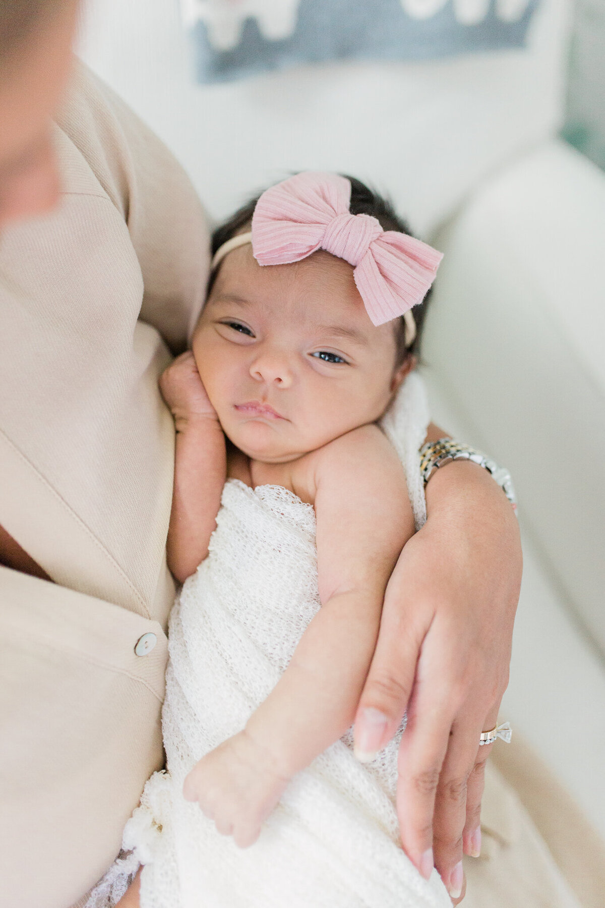 baby girl with bow newborn session