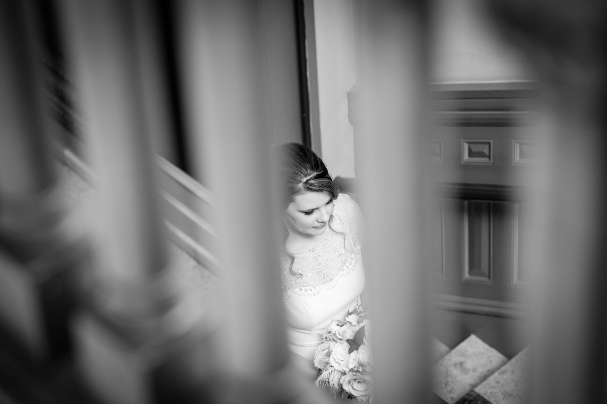 driskill wedding photographer bride walking down stairs 604 Brazos St, Austin, TX 78701
