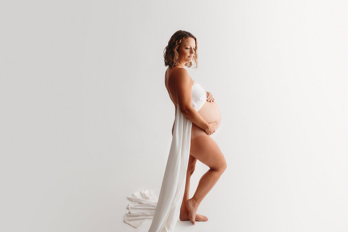 Pregnant mother poses for Maternity Photos in Asheville, NC.
