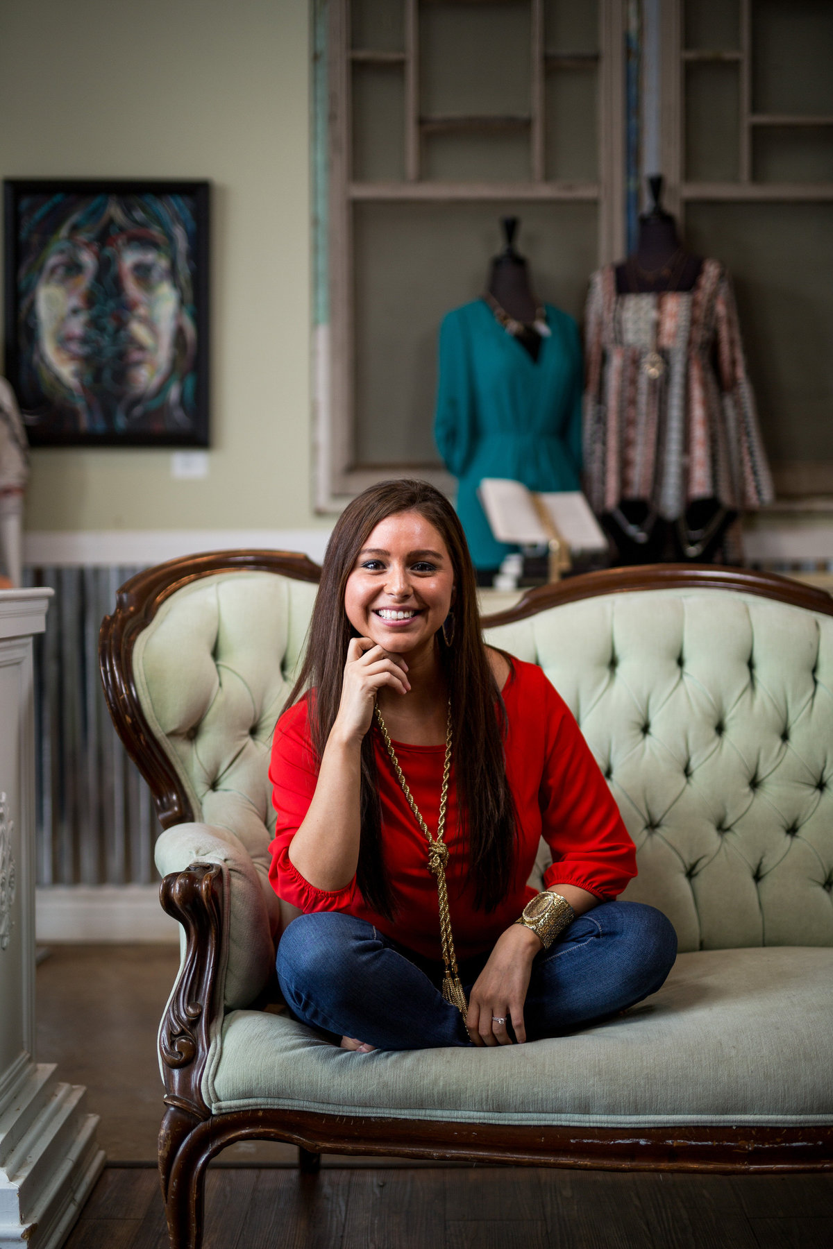 clothing boutique owner portrait on couch taken by San Antonio Photographer Expose The Heart Photography