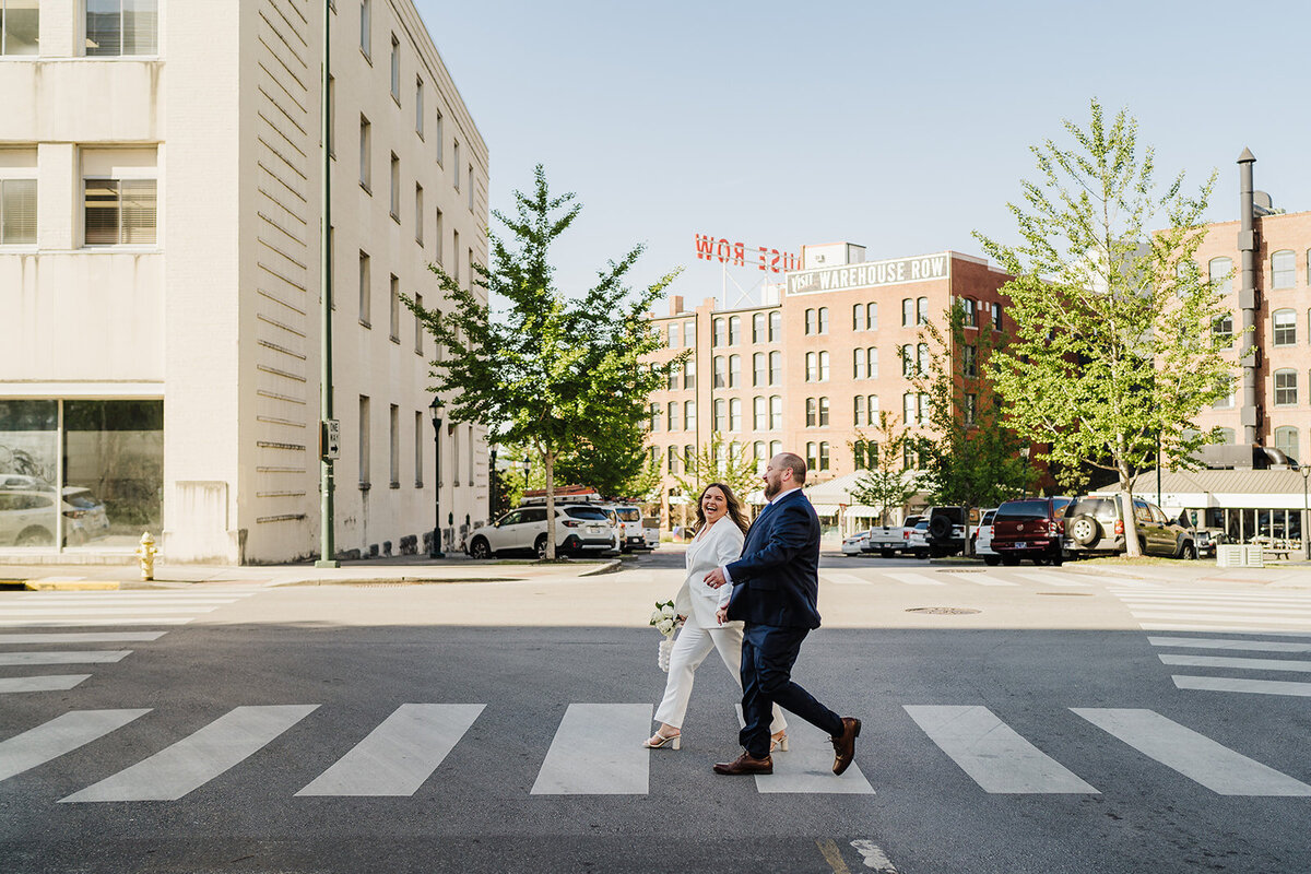 Couple in crosswalk during elopement in Chattanooga's Warehouse Row.