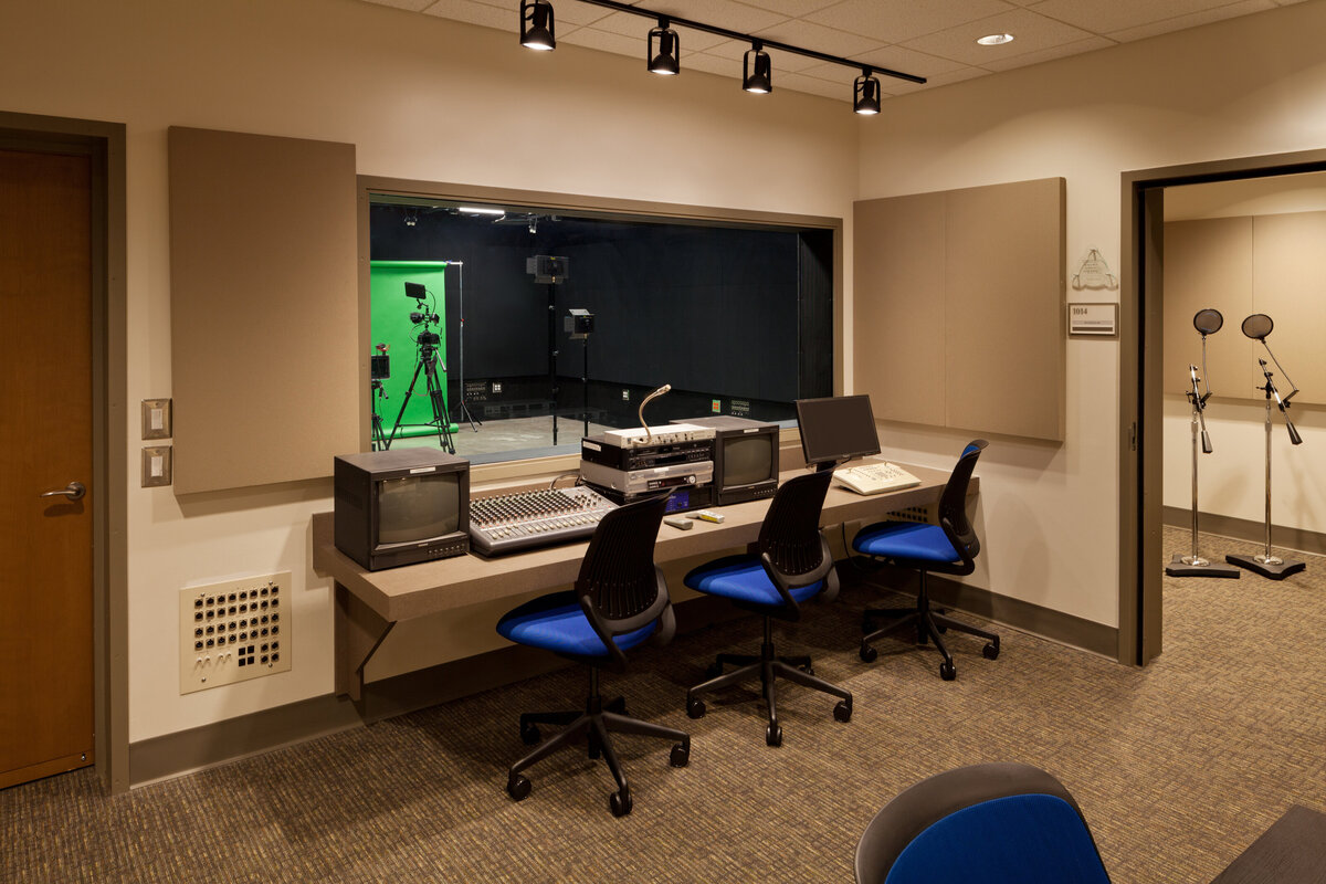 inside the multi media lab at Trinity School with green screen, recording room and mixing station
