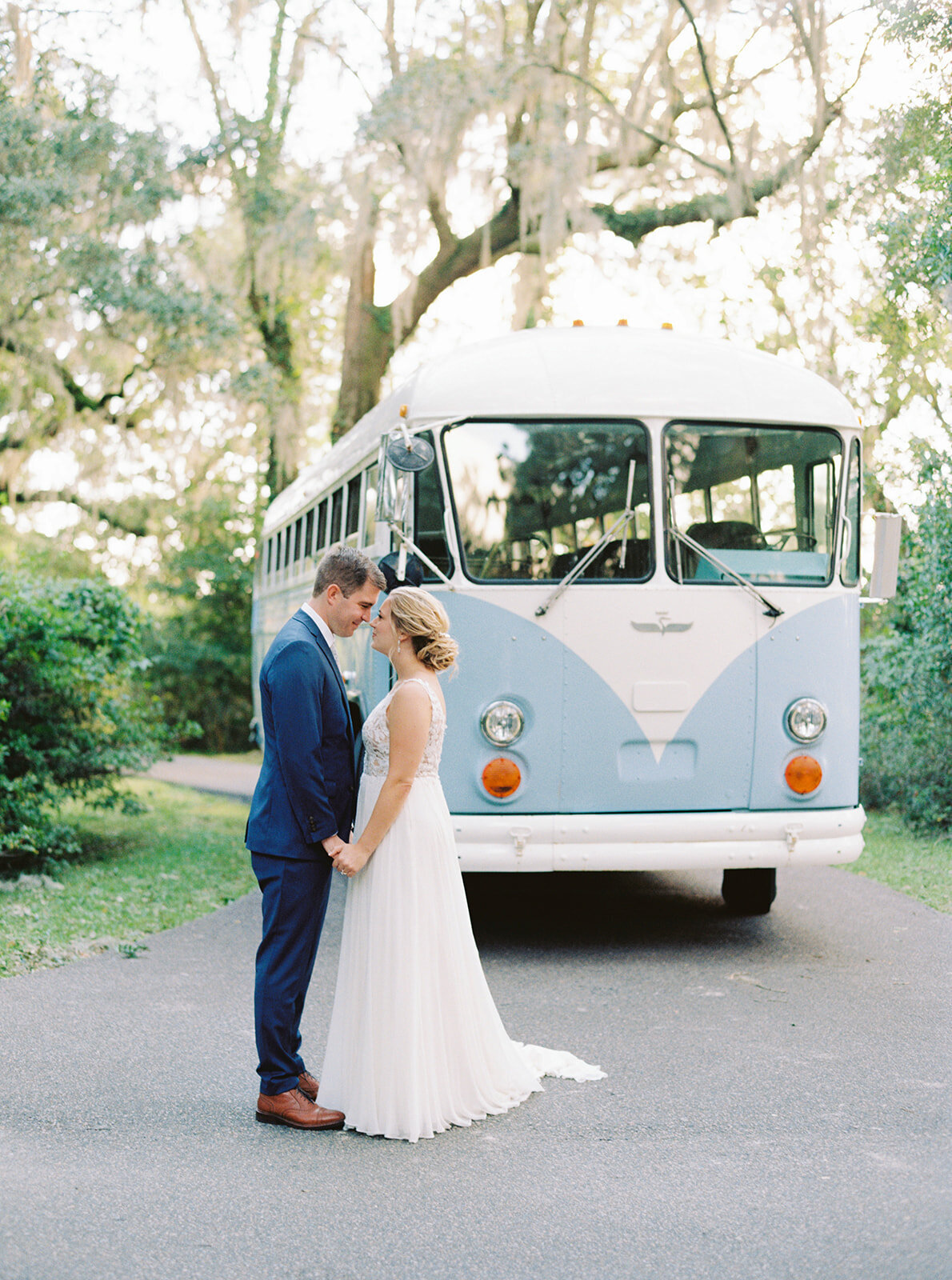 Blue and white vintage bus. Rent this bus for your wedding in Charleston. Charleston film photographer.