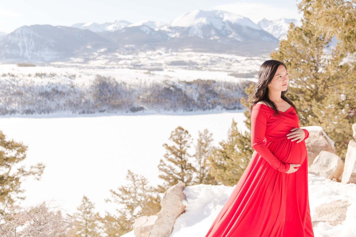 Rocky mountains and Lake Dillon behind pregnant woman