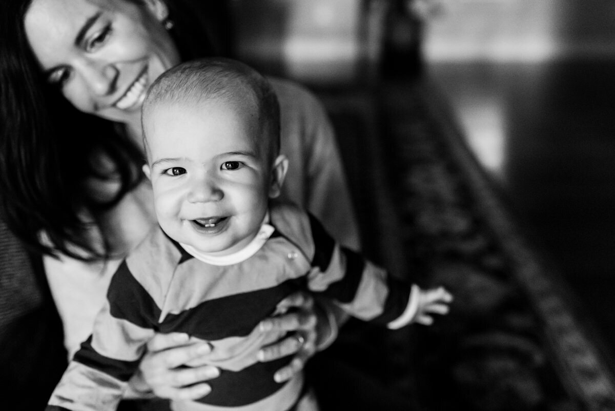 black and white photo of mom holding baby boy