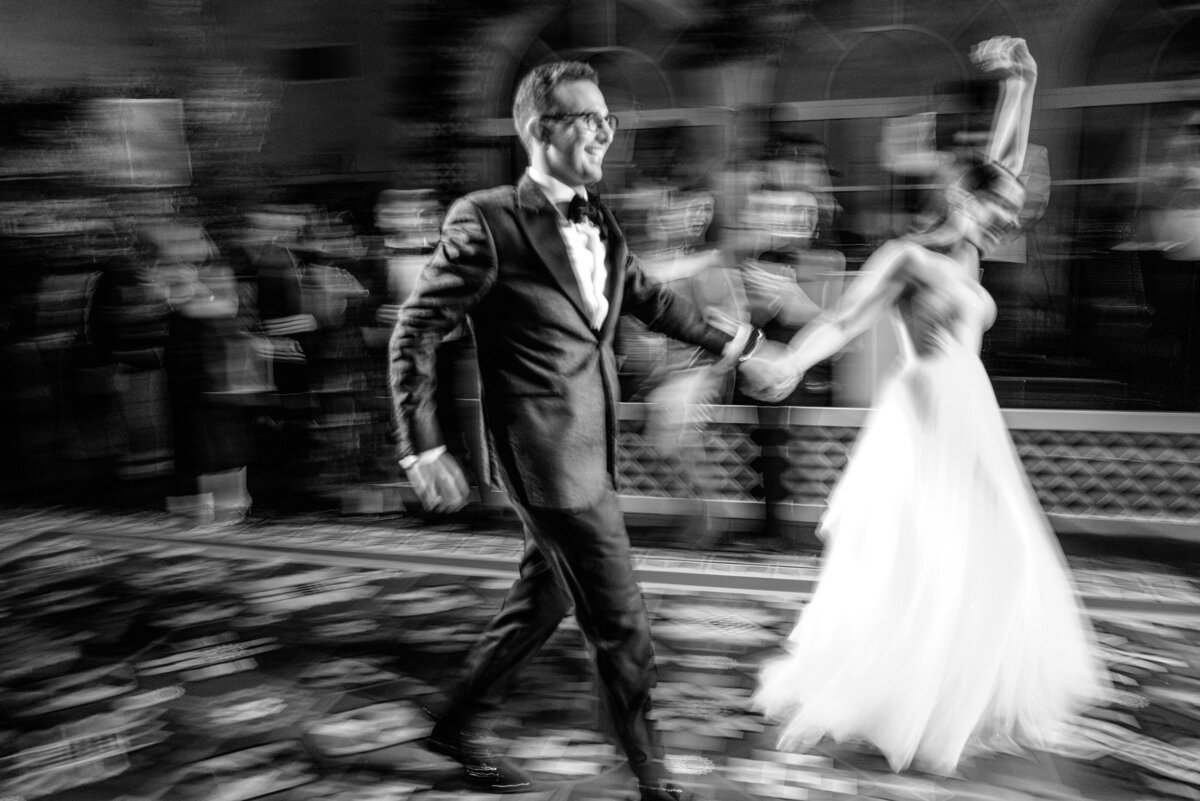 couple running onto dance floor