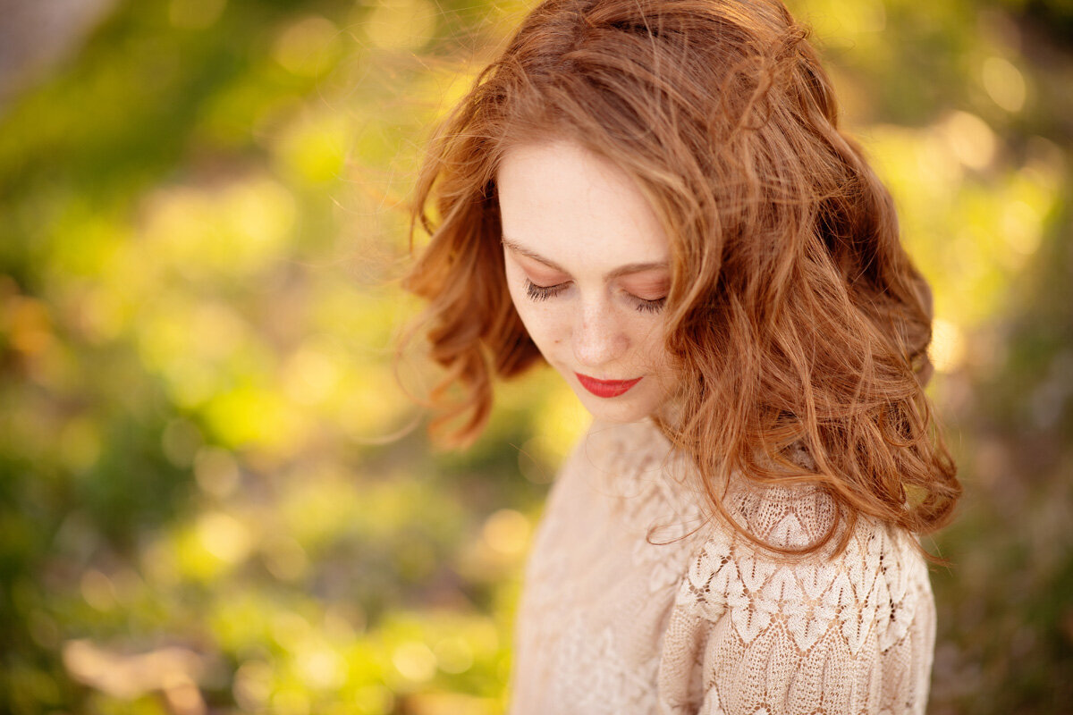 Senior session of young woman looking down