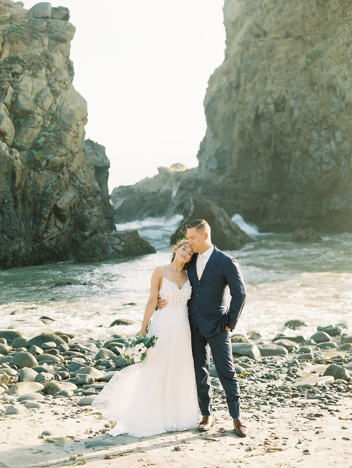 Bride and groom on the beach in Big Sur. Pfeiffer Beach wedding photos. California Destination Wedding Photographer. Film photographer. Golden light before sunset.