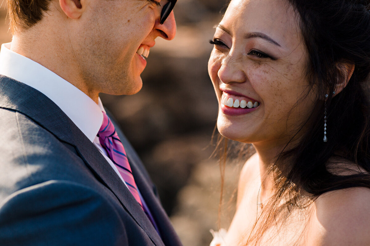 Cliff House elopement at Cape Neddick with the couple smiling during golden hour