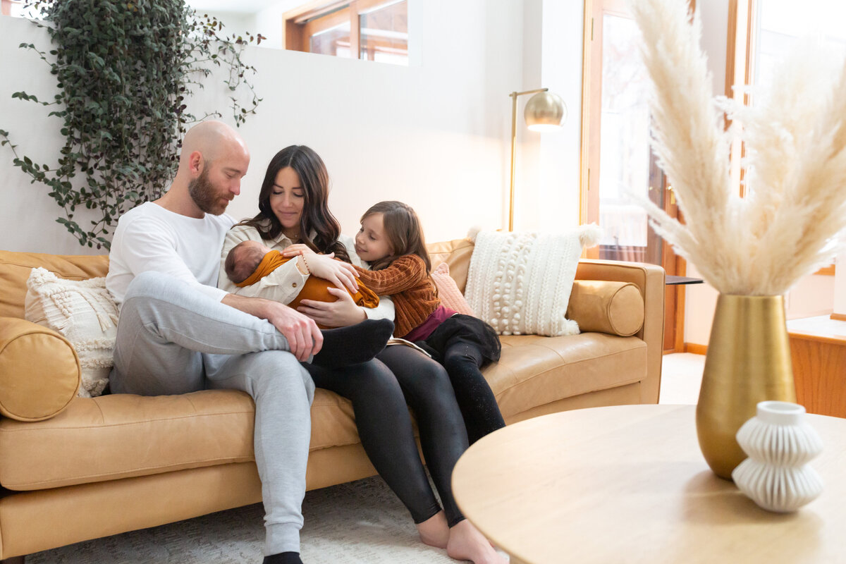 Family with newborn on couch - Naperville Lifestyle Photographer - Jen Madigan