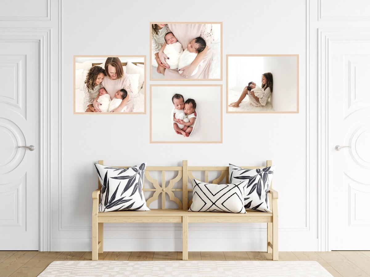 A cozy and stylish interior space featuring a wooden bench with patterned cushions against a white wall, adorned with framed photographs of a mother and her baby sharing tender moments.