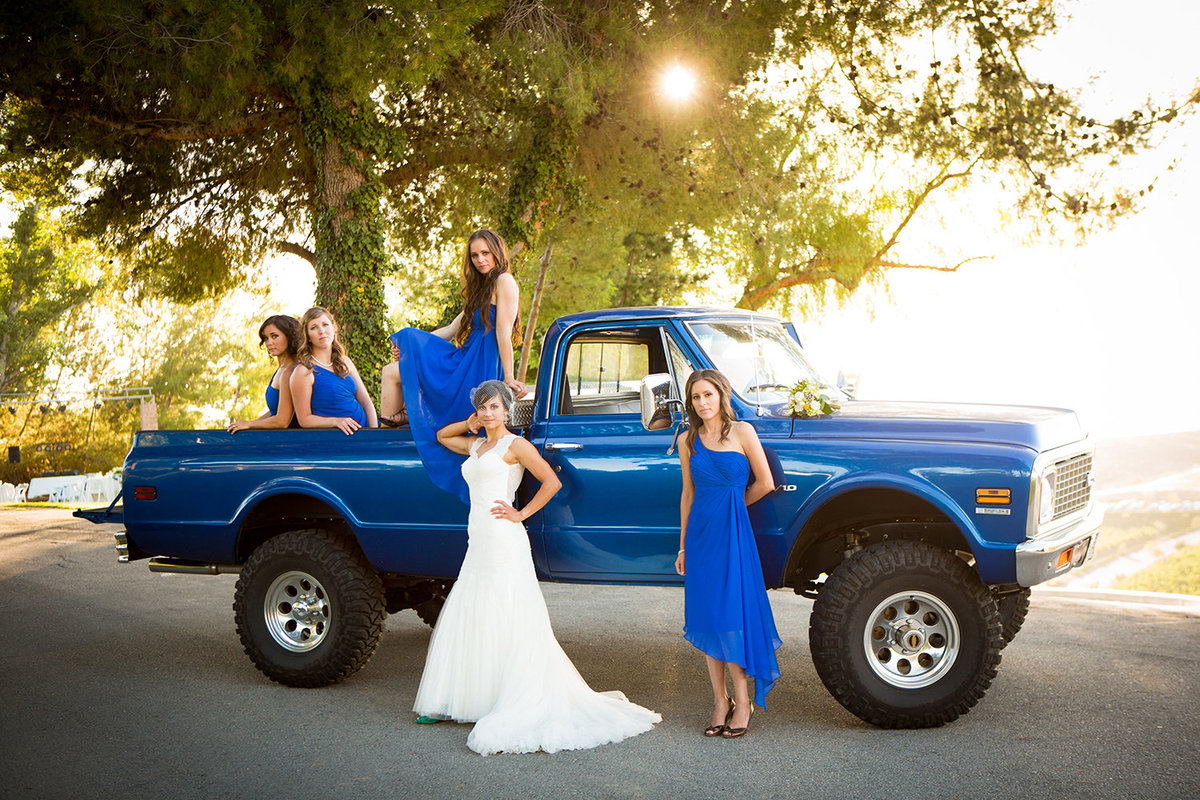 wedding photos bride and bridesmaids with monster truck