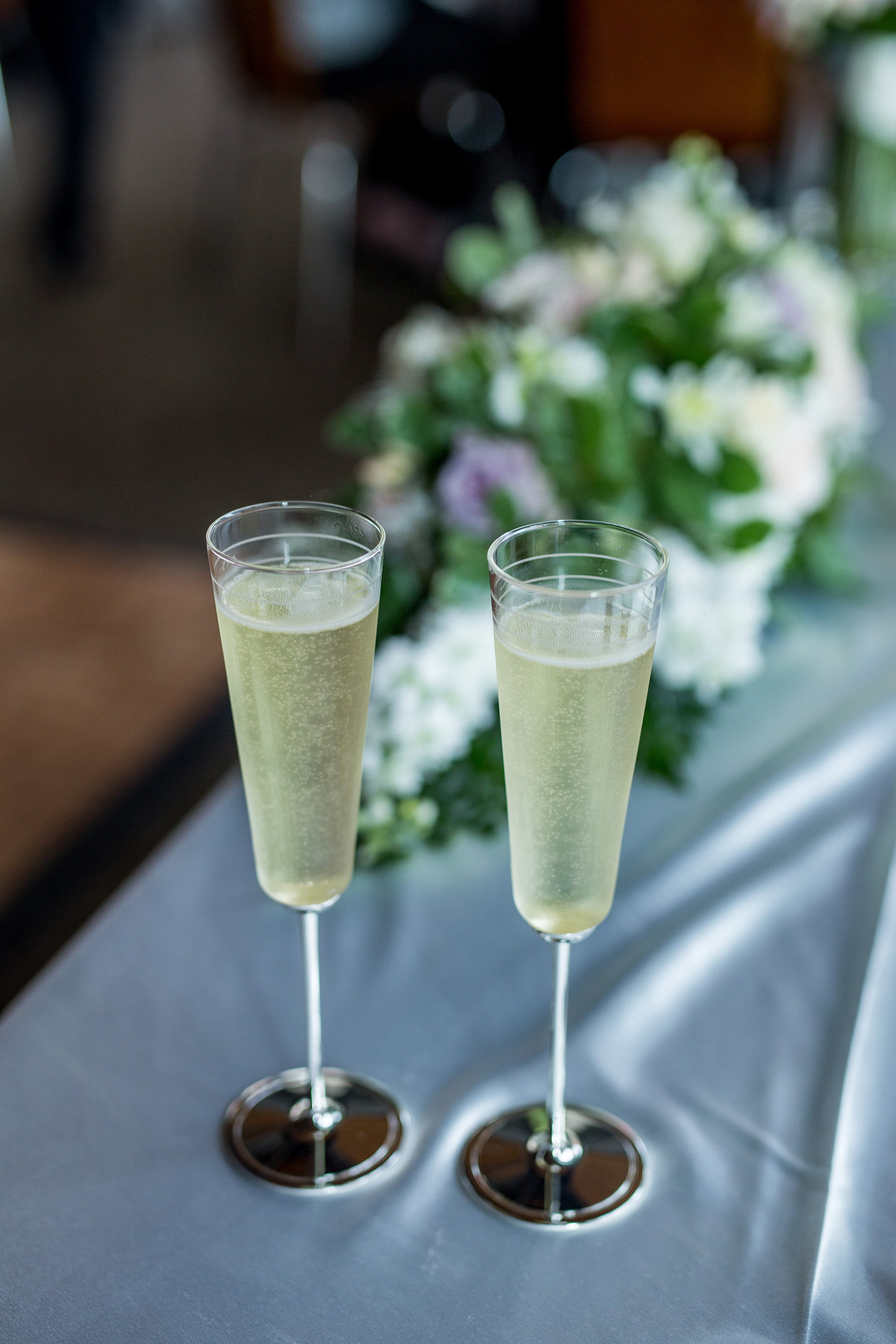 Beautiful champagne glasses for wedding toast during reception bride and groom set at Granberry Hills in San Antonio
