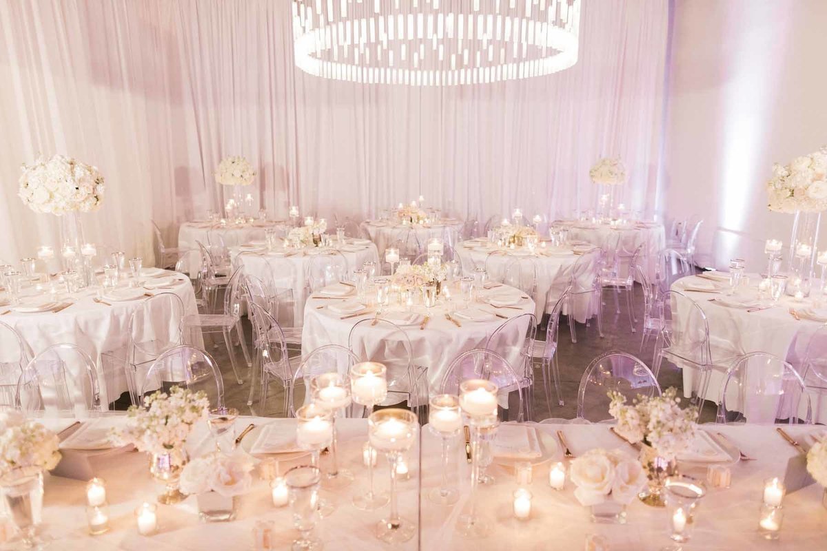 Truly a romantic look achieved with clear ghost chairs and all white floral