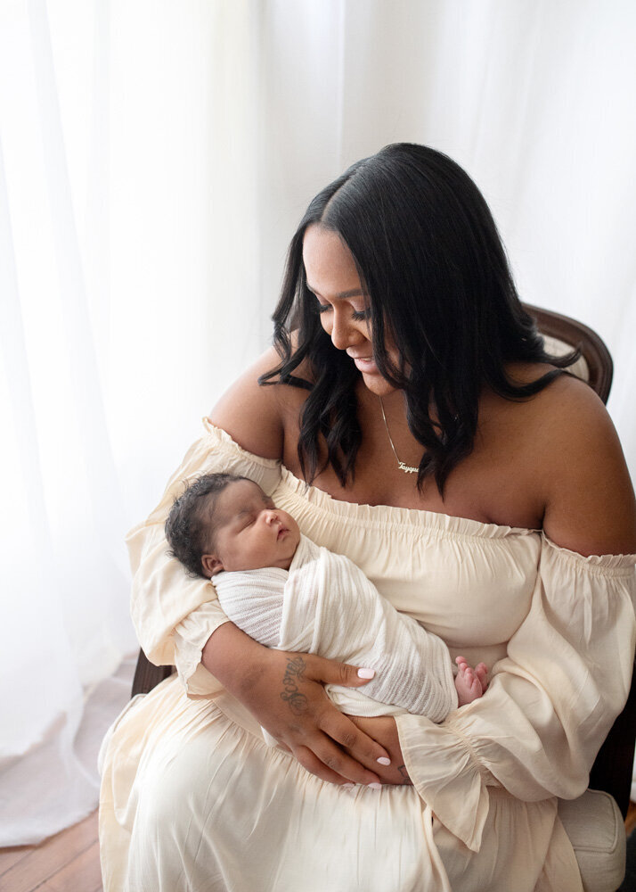 Newborn session baby boy with mother in a dress
