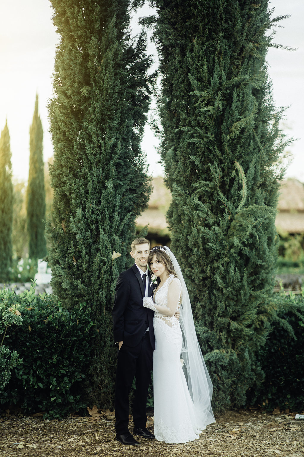 Wedding Photograph Of Bride ANd Groom Holding Each Other In The Garden Los Angeles