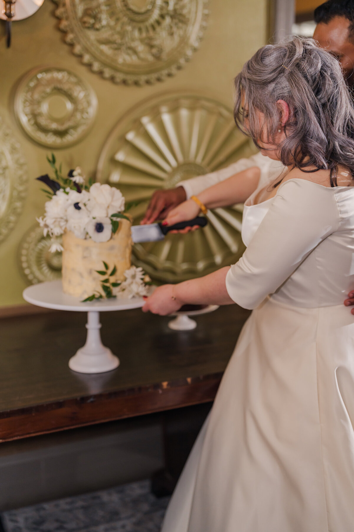 Bride and groom cutting cake at Parlour Canberra