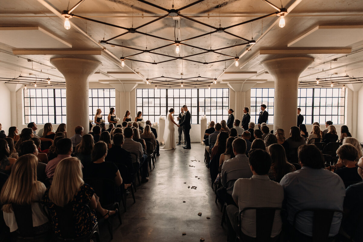 backlit indoor wedding ceremony