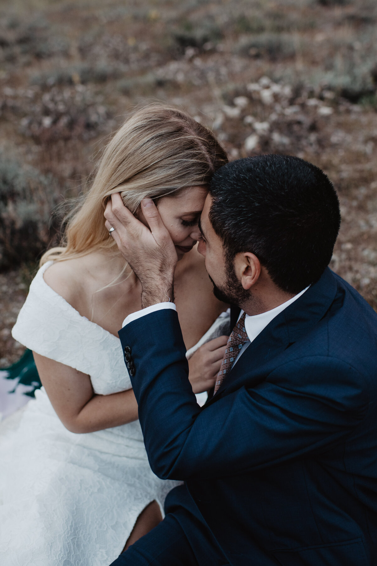Photographers Jackson Hole capture groom holding bride's face