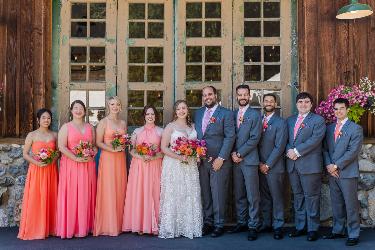 Colorful-large-wedding-party-during-bridal-party-photos-at-outdoor-venue-Twin-Willow-Gardens-in-Snohomish-WA-photo-by-Joanna-Monger-Photography