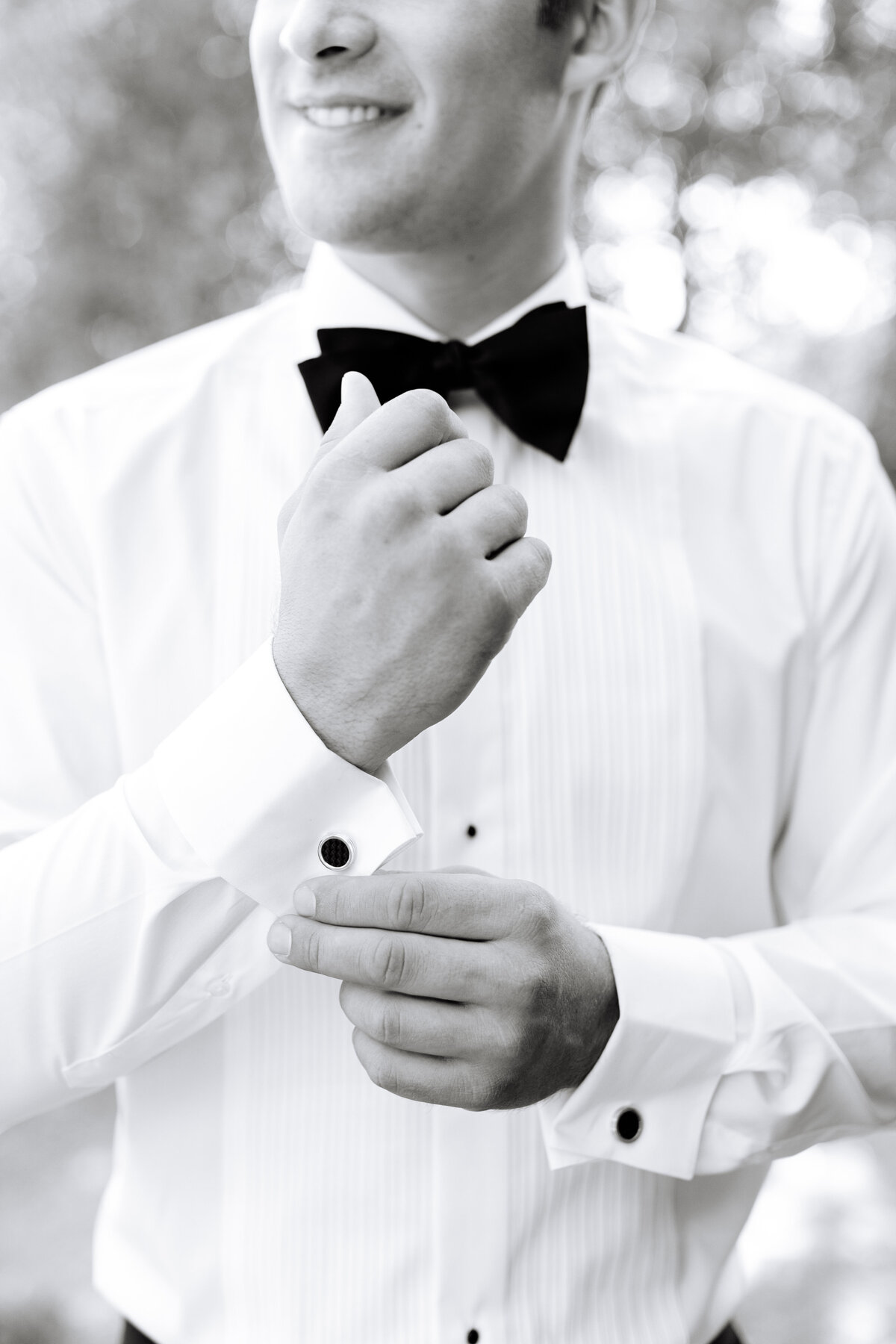 black and white close-up image of groom with a bowtie.