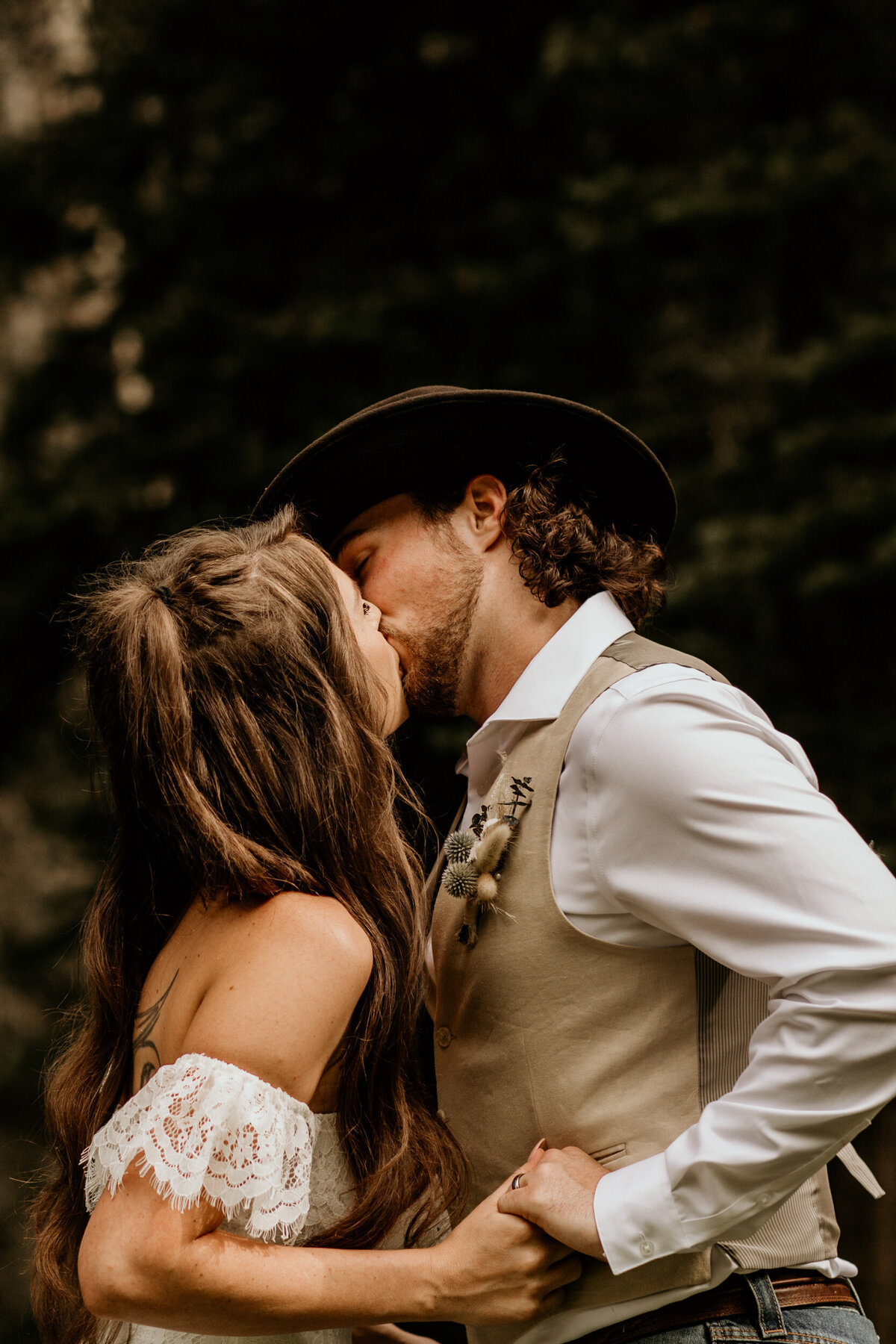 bride and grooms first kiss at New Mexico mountain top ceremony