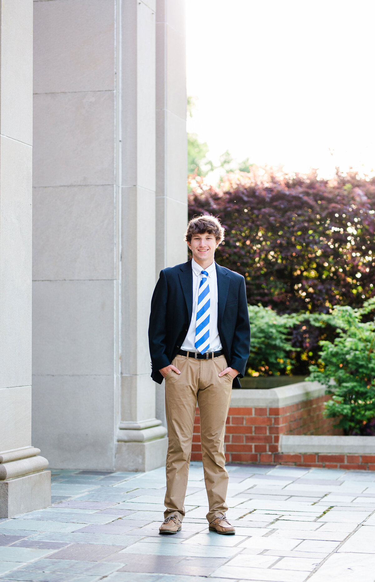 McCallie School senior posing in front of the chapel in spring