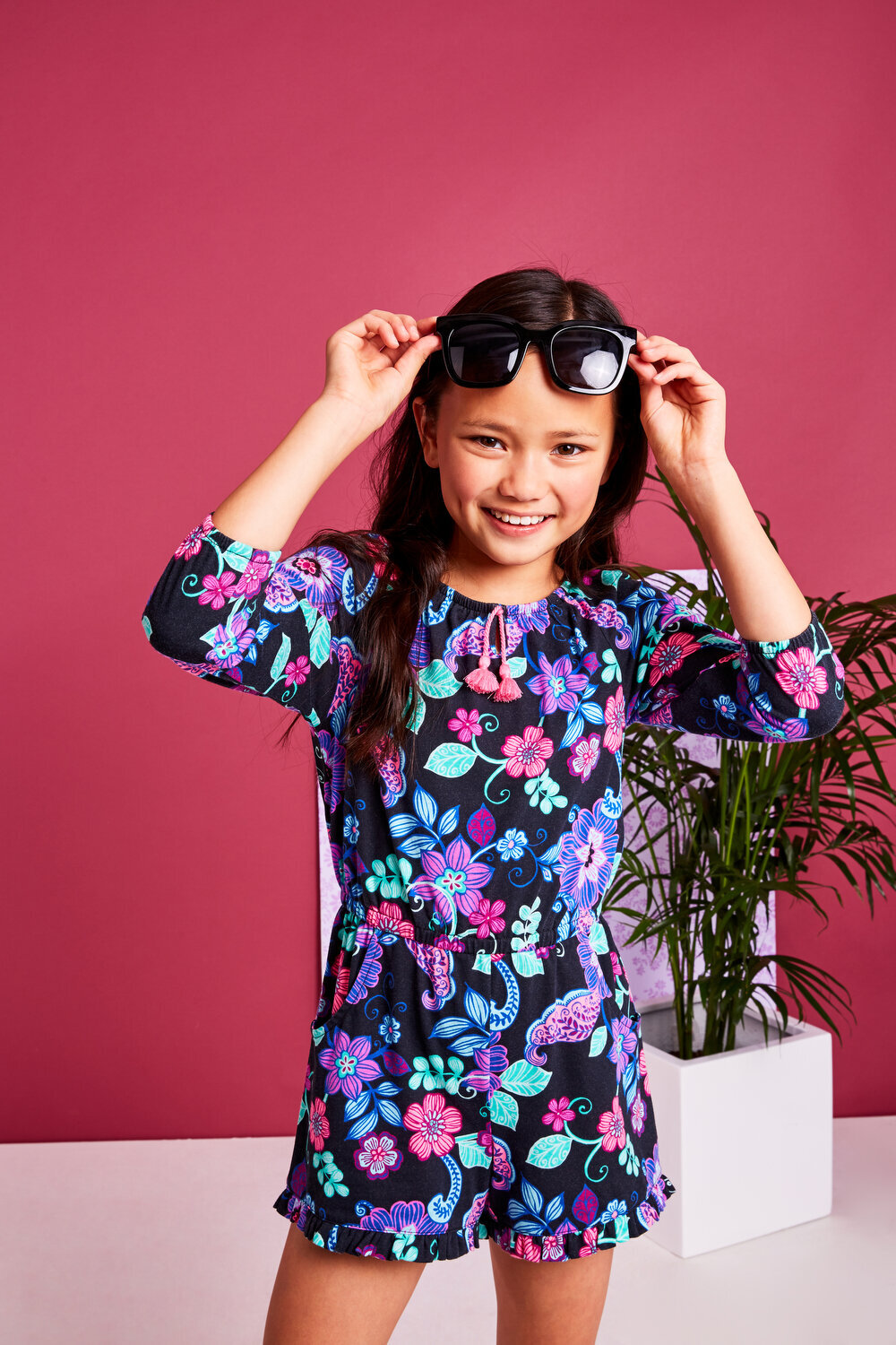 Greer Rivera Photography Kids Editorial Photoshoots Marin  Girl in flower romper holding glasses on her forehead