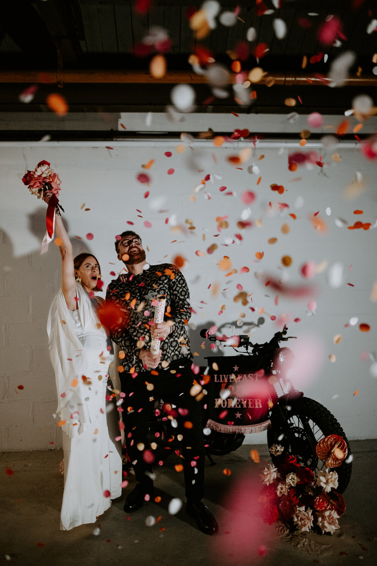 A wedding couple fire a confetti canon at their wedding in Las Vegas.