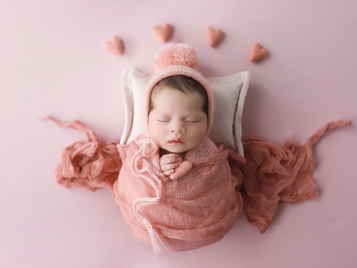 Oakville-newborn-baby-girl-wrapped-in-pink