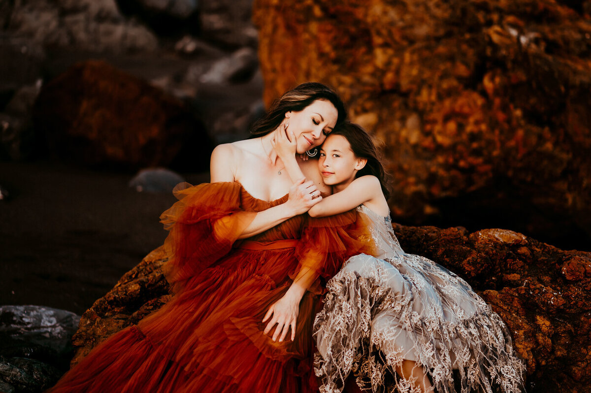 Mother and daughter embracing each other at a San Francisco beach
