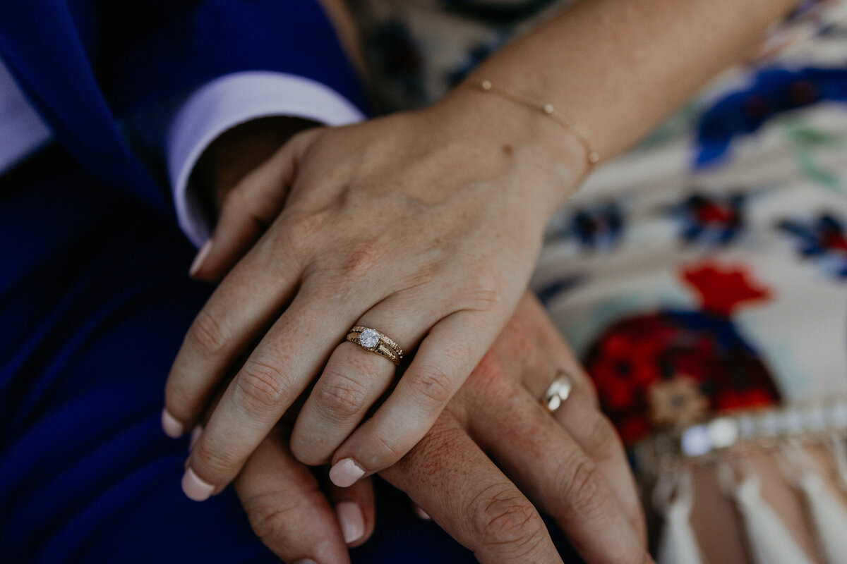 newlyweds hands together with their wedding rings