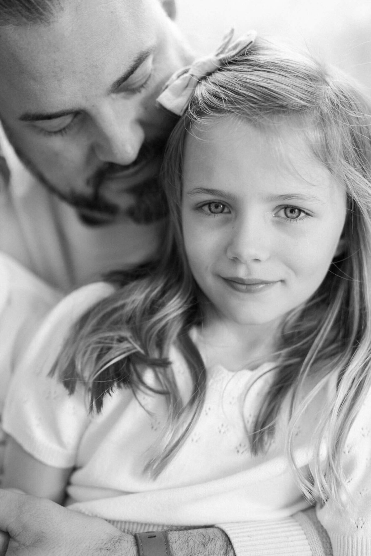 serious black and white of daughter and father By Carrie Pellerin