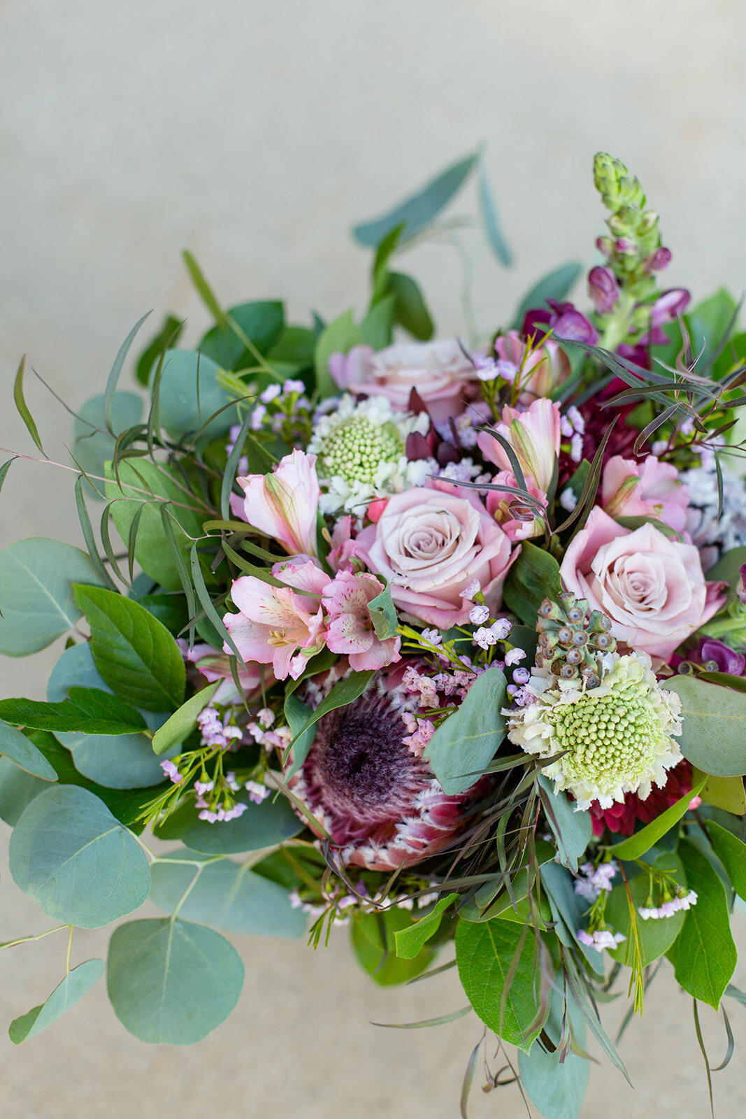 Beautiful wedding bouquet pinks greens and eggplant