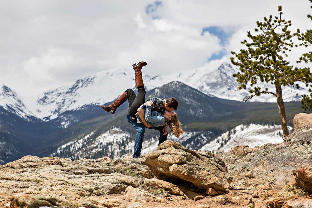 Fun swing dance couple during their engagement session in the mountains