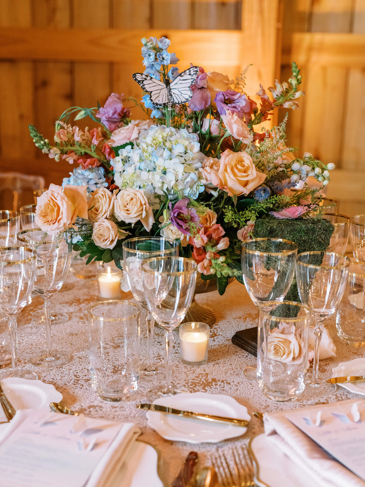 Farm wedding centerpiece of flowers and butterflies at Saddle Woods Farm in TN.