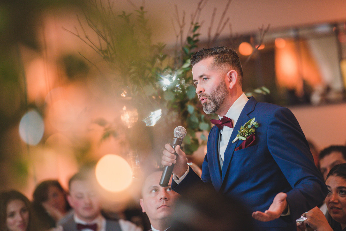 photo of best man making speech during wedding reception at The Vineyards at Aquebogue