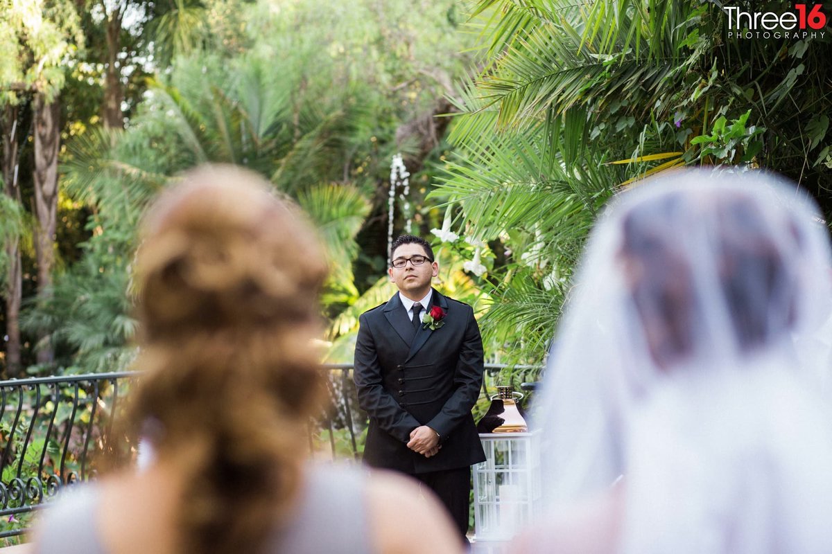 Groom waits at the altar as Bride is being escorted to him