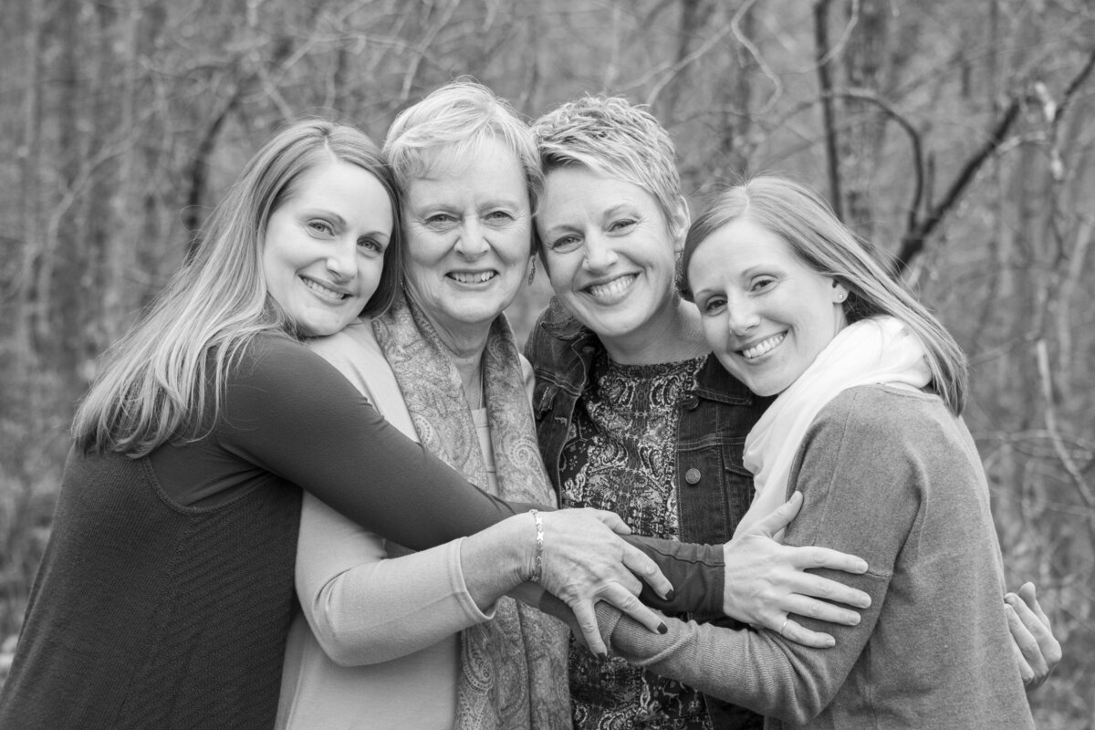 Family photography mom and daughters hugging Asheville, NC