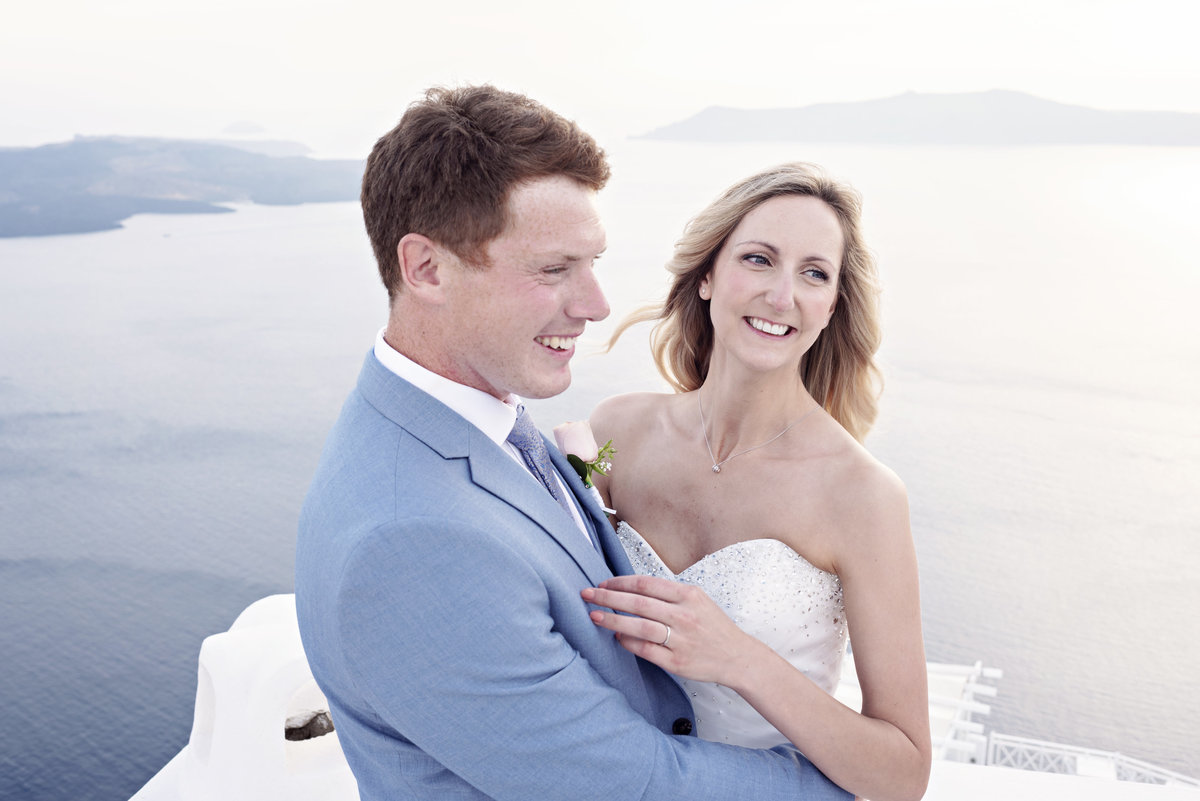 A fun unposed photograph of a  Bride and Groom on top of Dana Villas