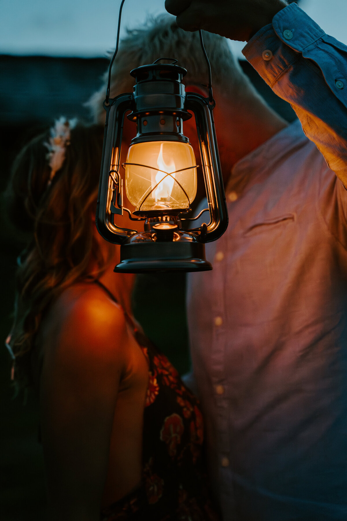 Couple holding a lantern in the Italian Dolomites