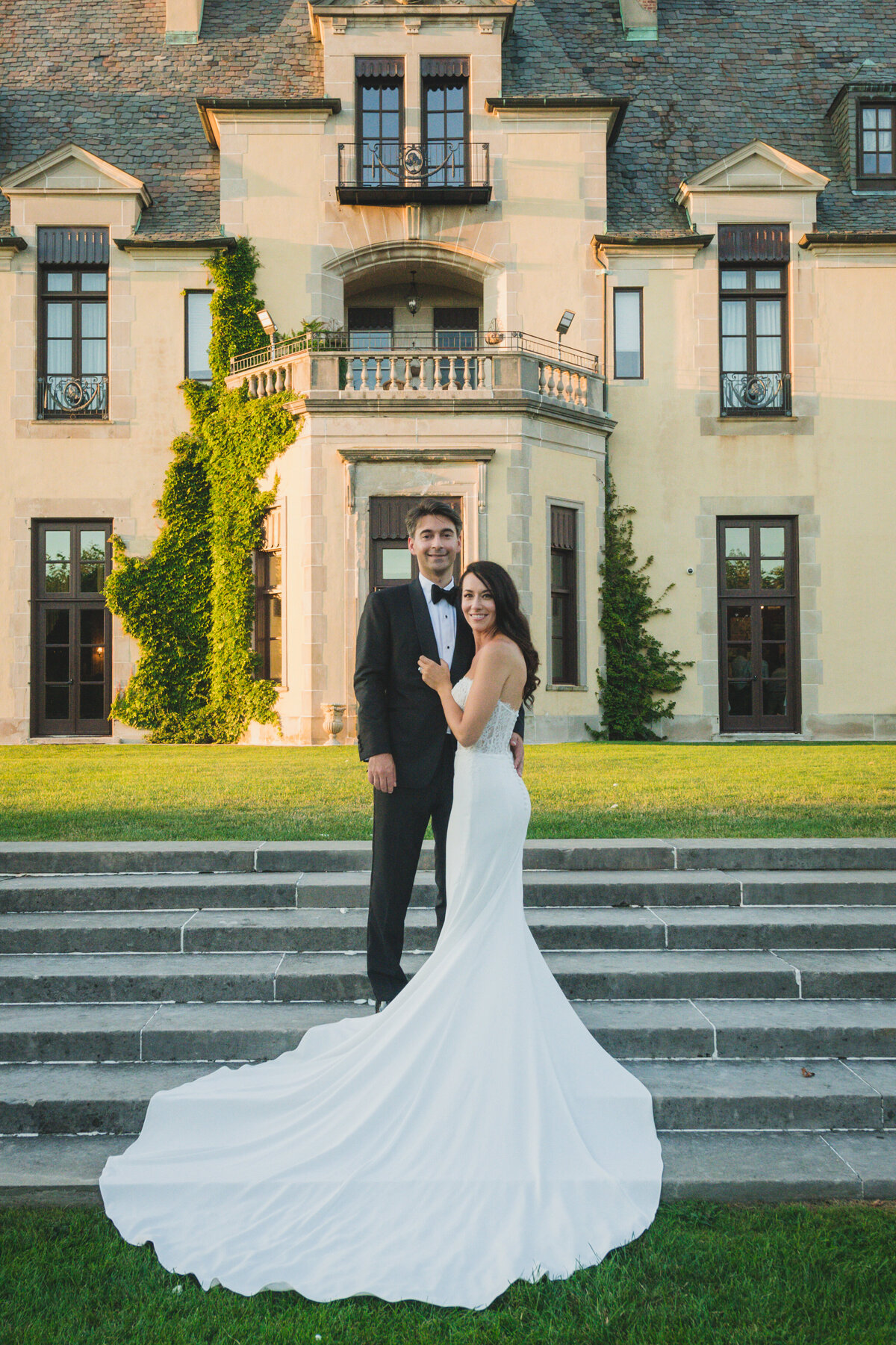 bride and groom outside Oheka Castle
